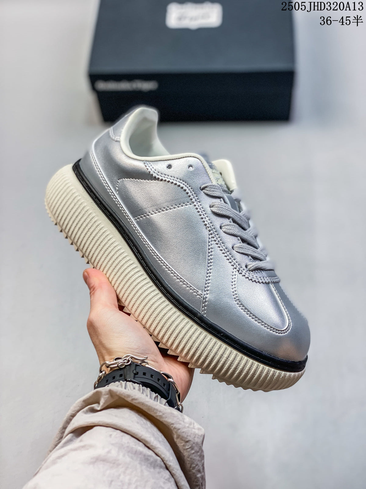 Side view highlighting the stitched panels and cream-colored ribbed sole