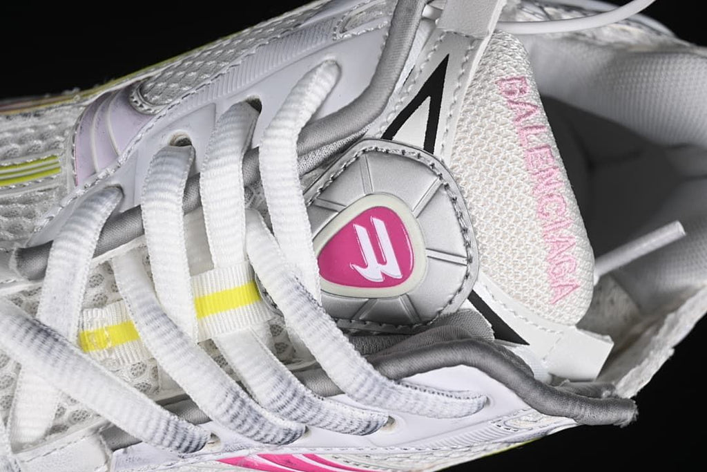Close-up of the laces, tongue, and decorative shoe hardware.