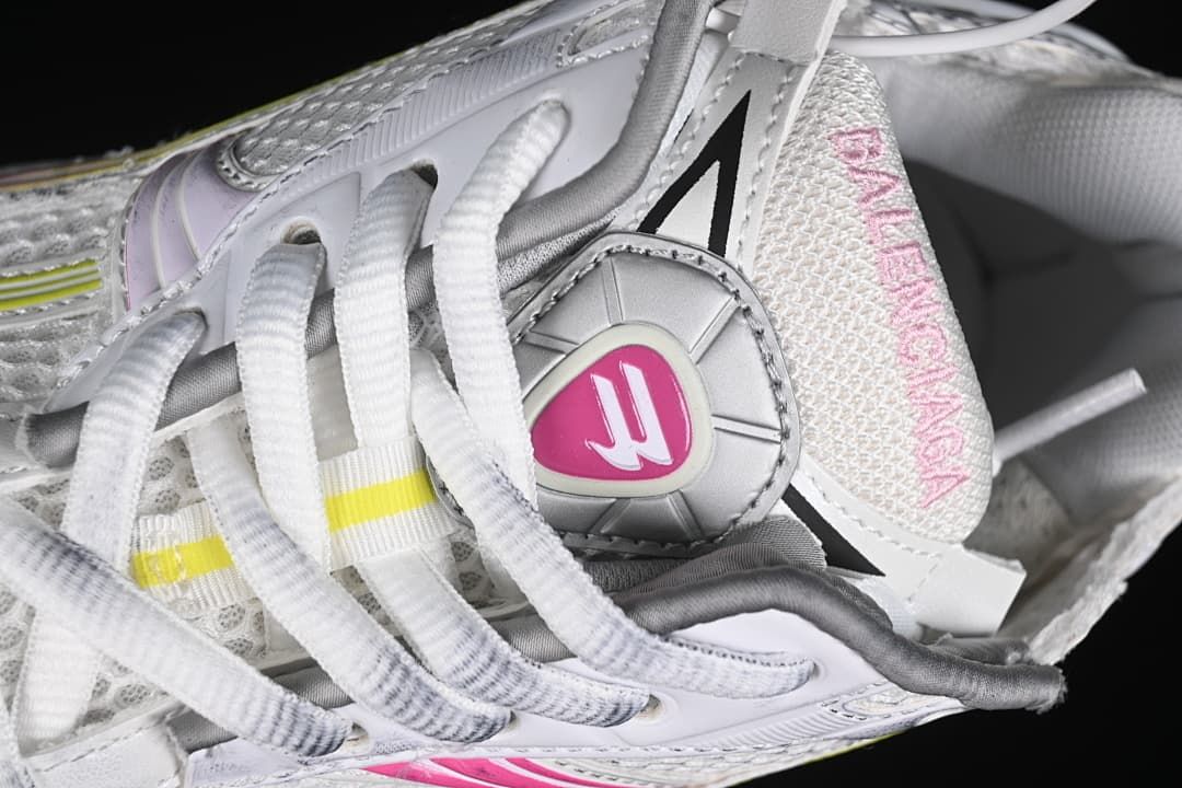 Close-up of the laces, tongue, and decorative shoe hardware.