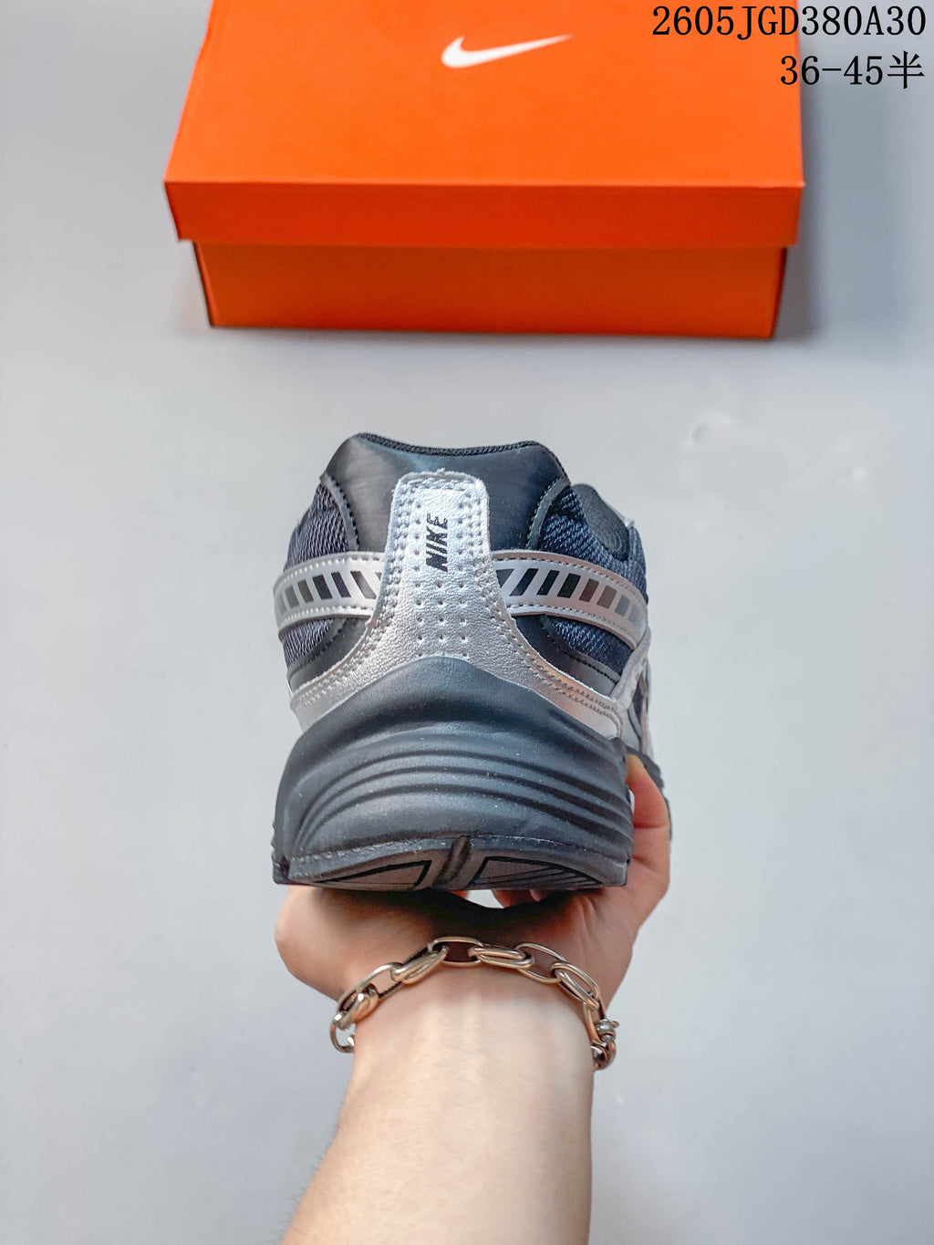 Rear view of a Nike Initiator sneaker showing the heel and layered overlays