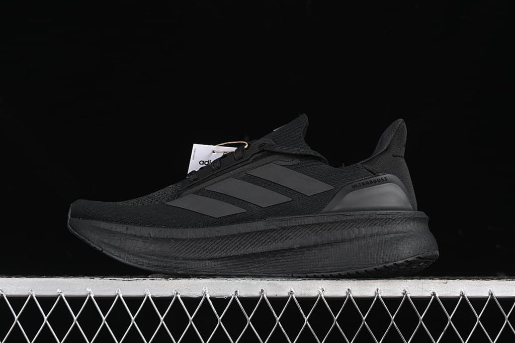 Side view of a black adidas Ultraboost 5X shoe