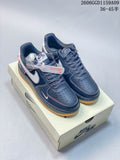 Pair of dark navy Nike Air Force 1 low-top sneakers with white Swooshes and gum-colored soles.