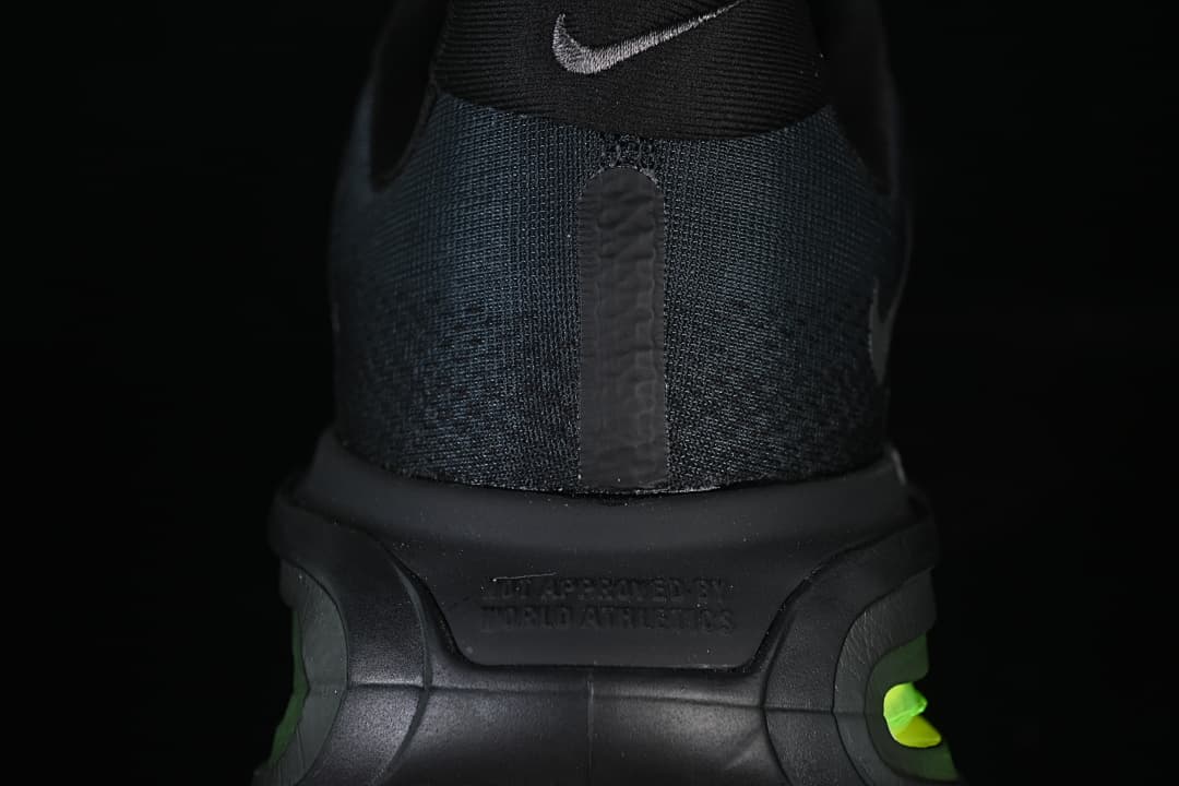 Rear view of the shoe showing the heel, small Swoosh, and thick sole.