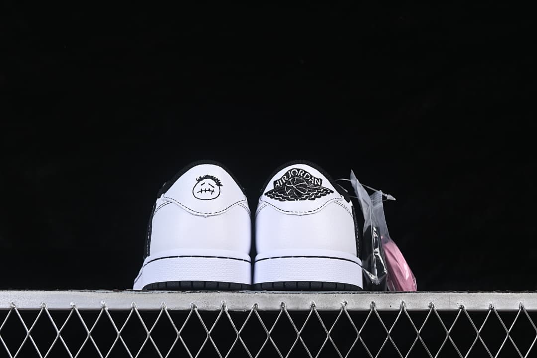 Rear view showing differing graphic details on the heel tabs and an extra lace pack.