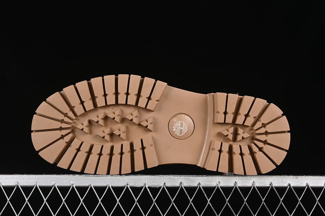 Underside of the boot showing the lugged tread pattern.