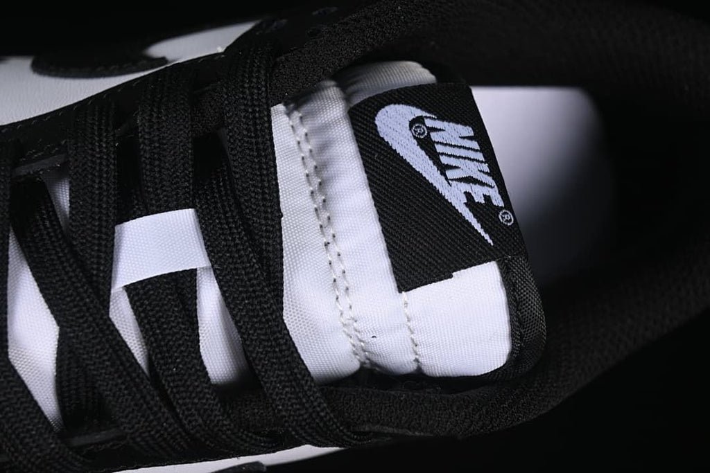 Close-up of the sneaker tongue label and black laces