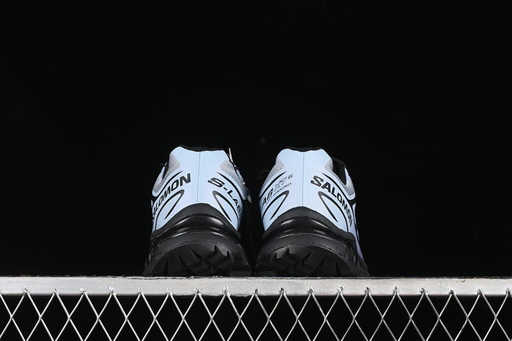 Rear view of the pair showing heel branding and black outsole.