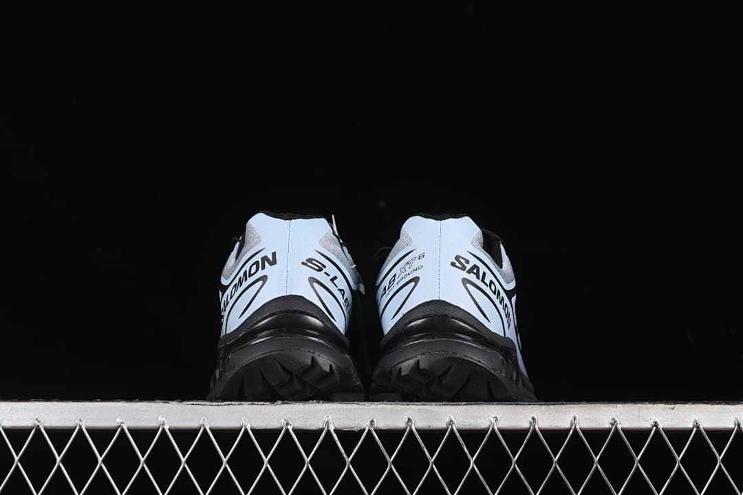 Rear view of the pair showing heel branding and black outsole.