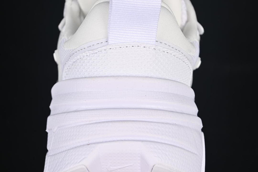 Rear close-up of the white sneaker showing the heel and layered sole
