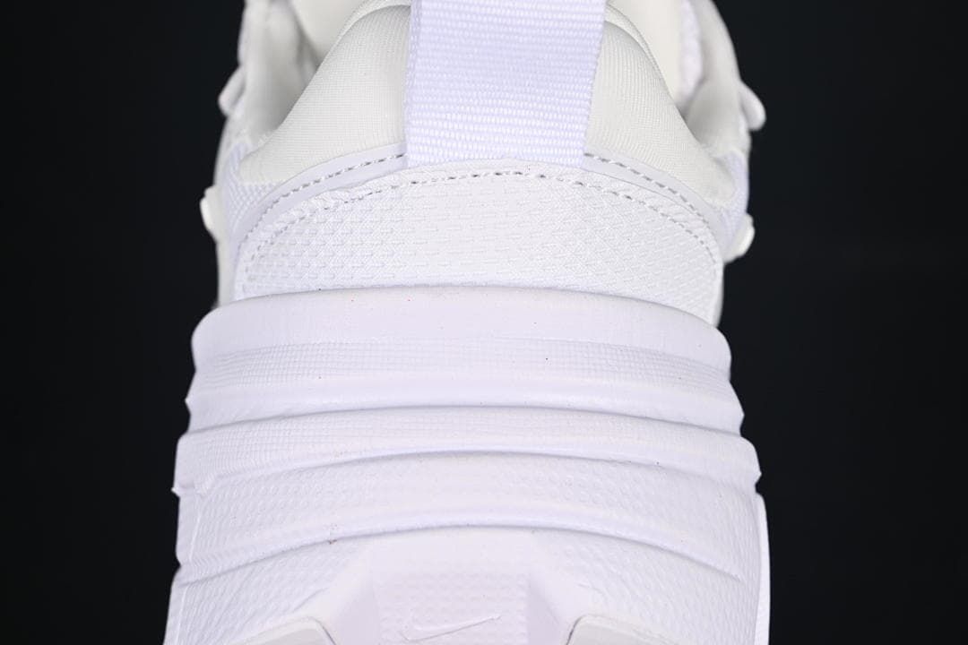 Rear close-up of the white sneaker showing the heel and layered sole
