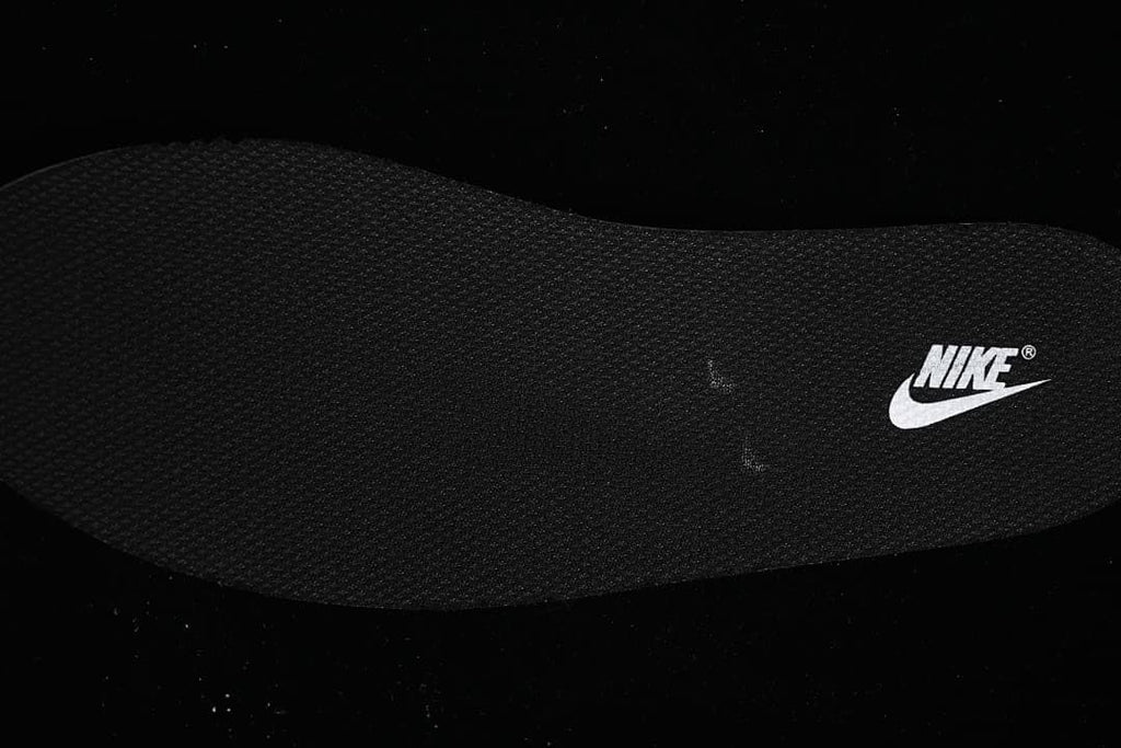 Dark textured insole with a Nike logo