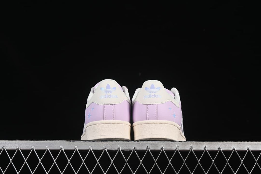 Rear view of the pair showing heel tabs and lilac-pink heel panels