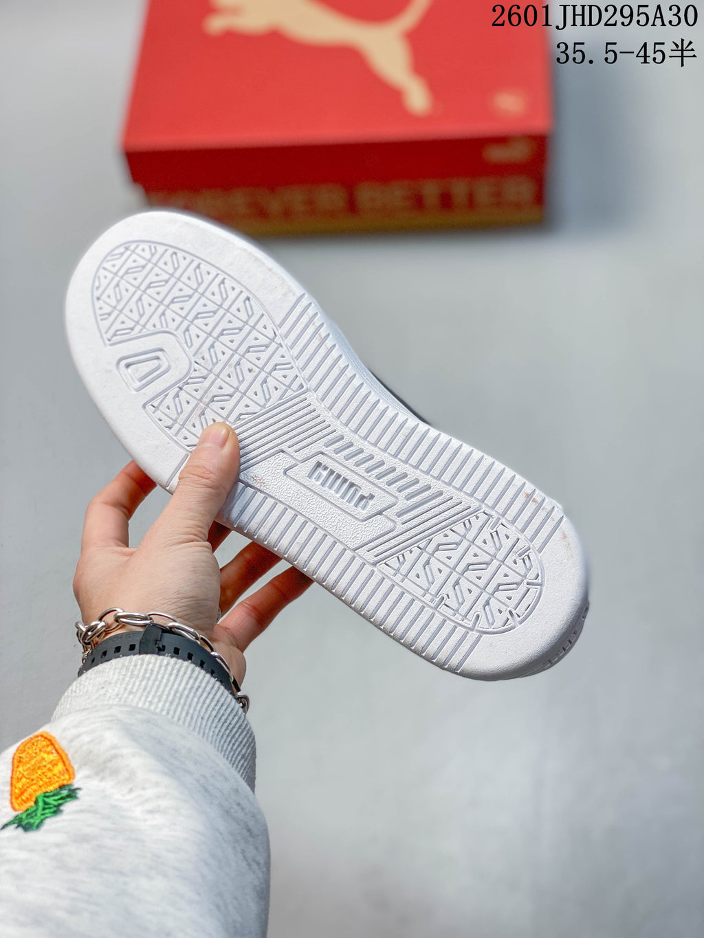 Close-up of the patterned outsole on a white Puma Caven 2.0 sneaker