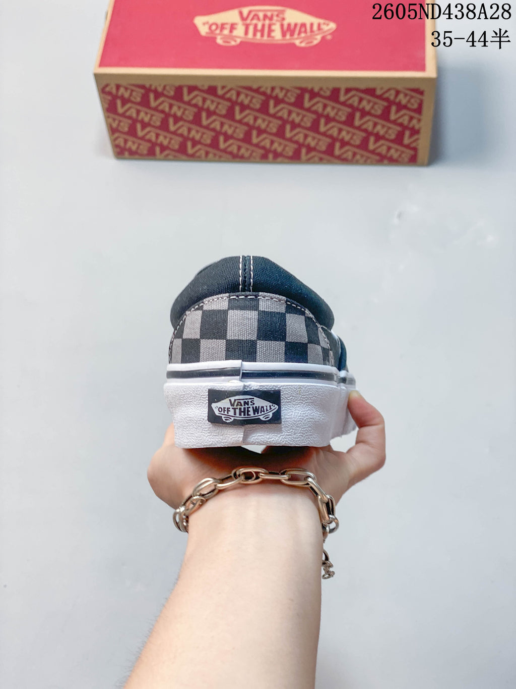 Rear view showing the checkerboard heel, heel tab, and white sole