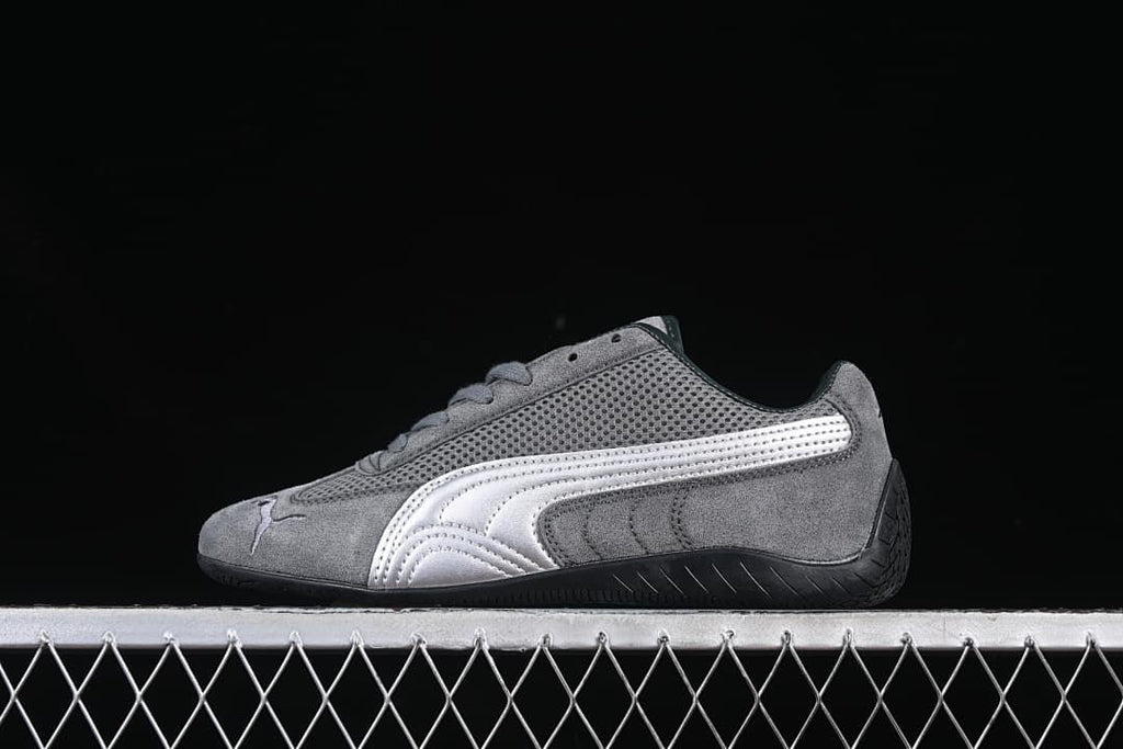 Side view of a gray Puma Speedcat sneaker with silver Formstrip