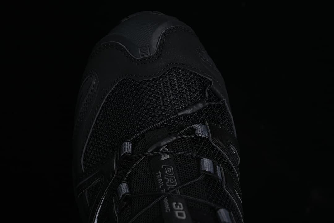 Top-down close-up of the black mesh toe and lace area