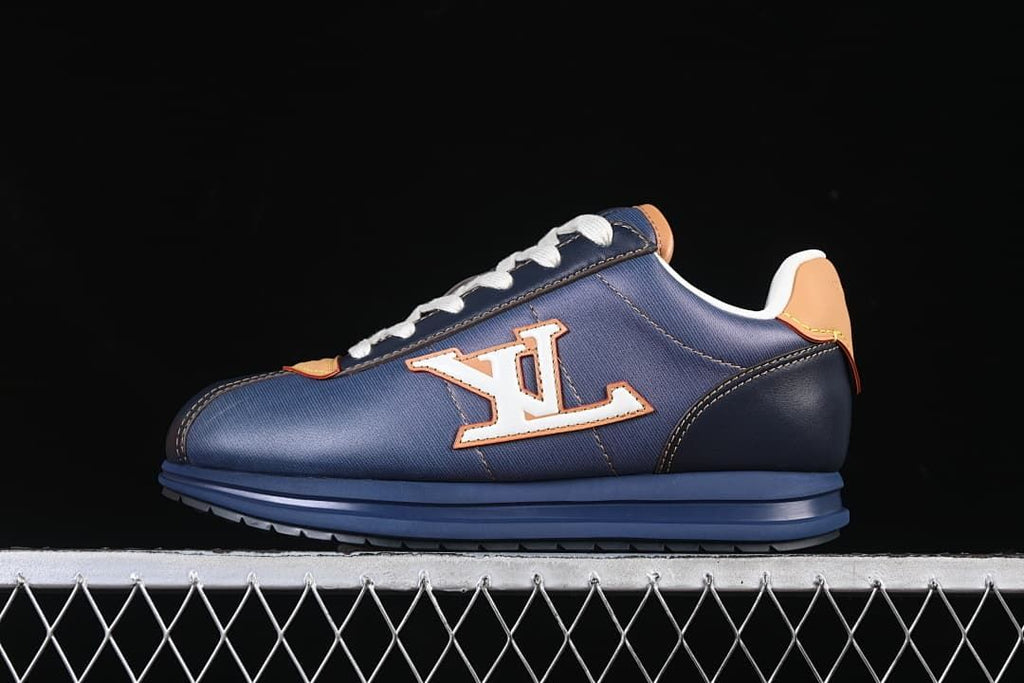 Side view of the dark blue sneaker with a contrasting side logo