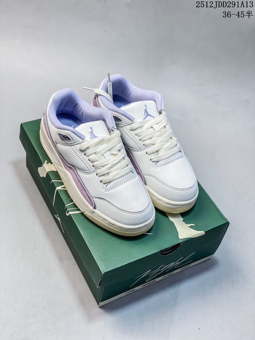 Pair of light-colored Jordan Flight Court ATE low-top sneakers with lavender accents on a green shoebox