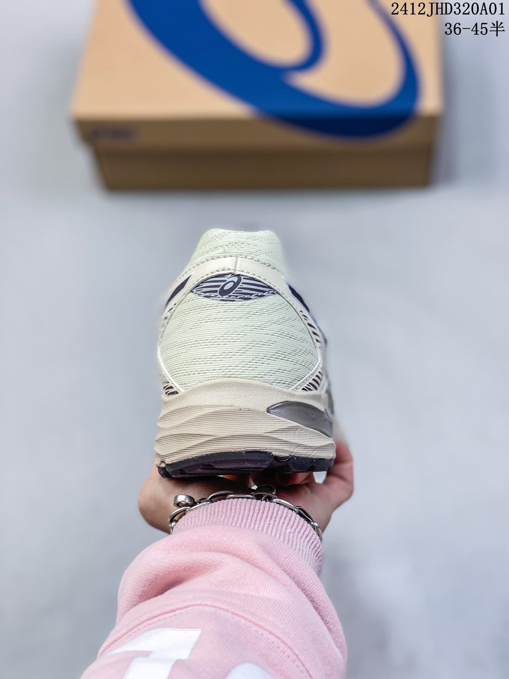 Rear view of a cream ASICS GEL-KAHANA 8 shoe