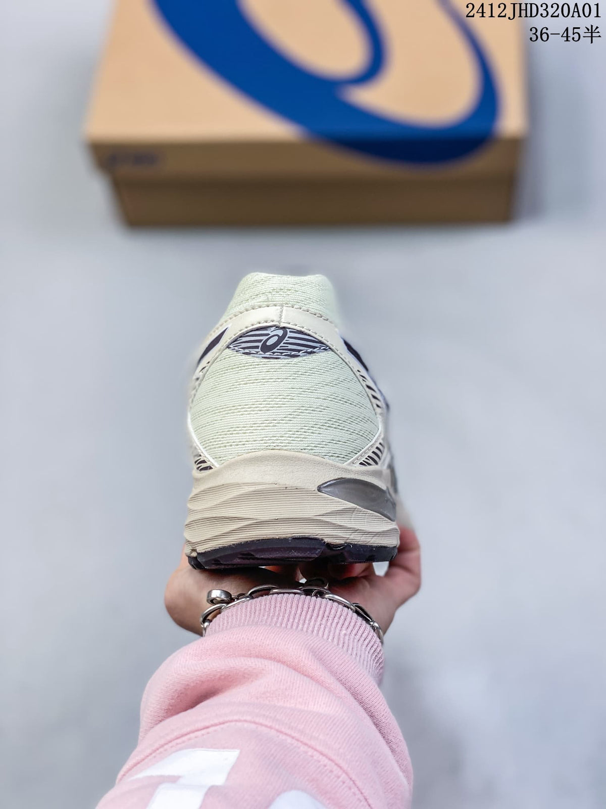 Rear view of a cream ASICS GEL-KAHANA 8 shoe