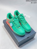 Pair of green Nike Air Force 1 low-top sneakers with coral and yellow-toned accents, shown on a box