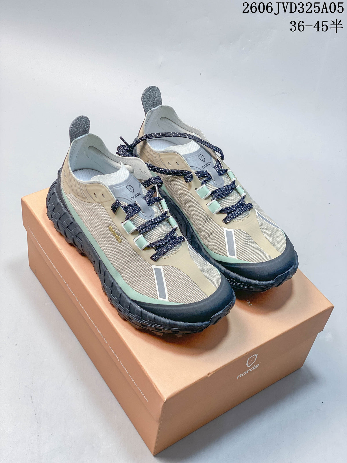 Pair of beige and mint Norda 001 trail running shoes on a branded box.