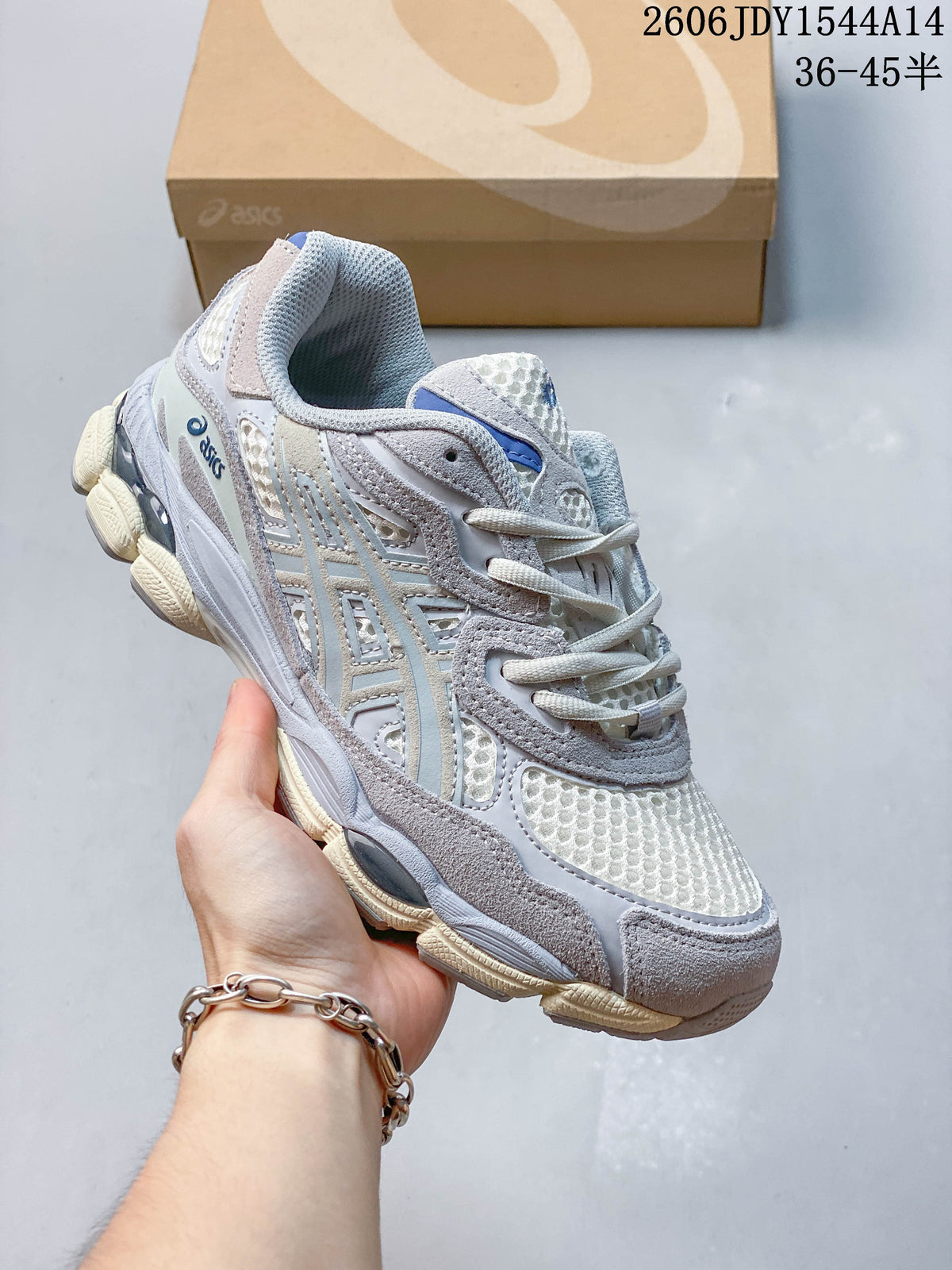 Angled side view of a white and grey ASICS GEL-NYC sneaker with blue details and a segmented sole.