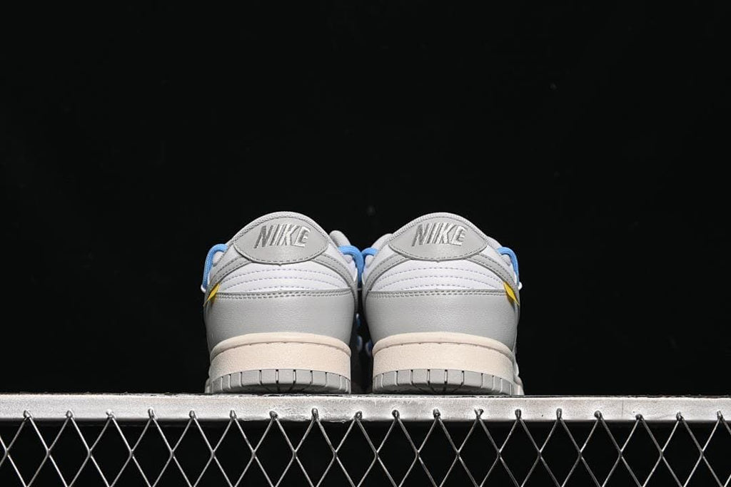 Rear view of the pair showing grey heel panels and Nike branding
