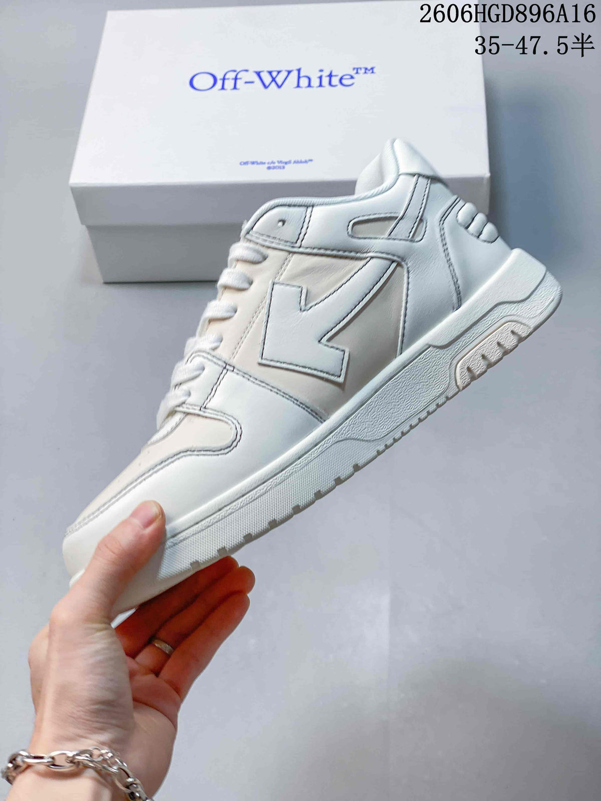 Side view of the white low-top sneaker with a large stitched side motif