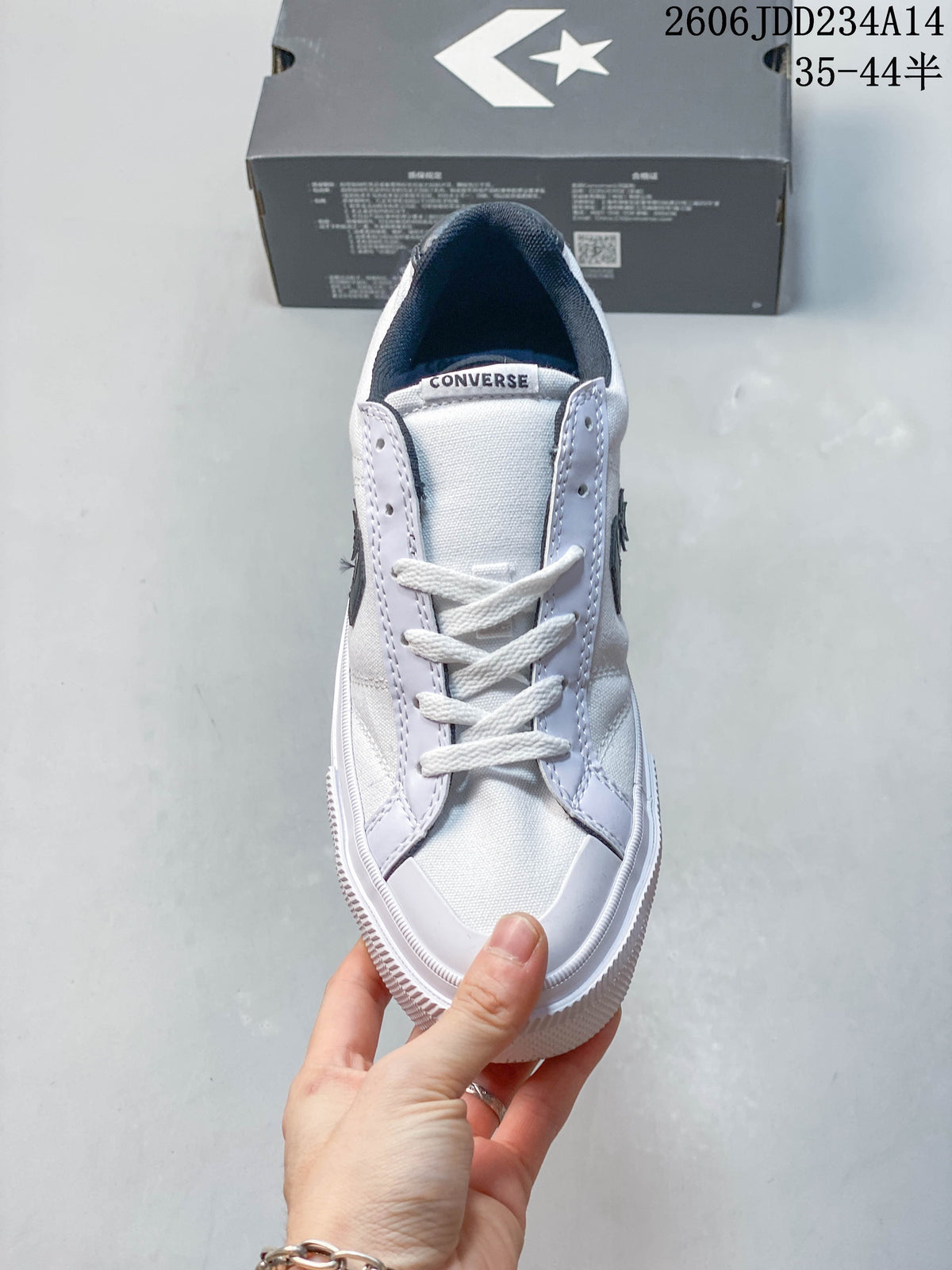 Front view of a white lace-up low-top sneaker