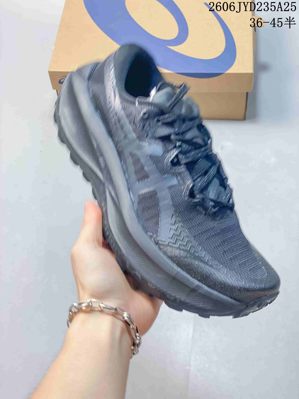 Side view of a dark charcoal ASICS GEL-TRABUCO MAX 5 shoe.
