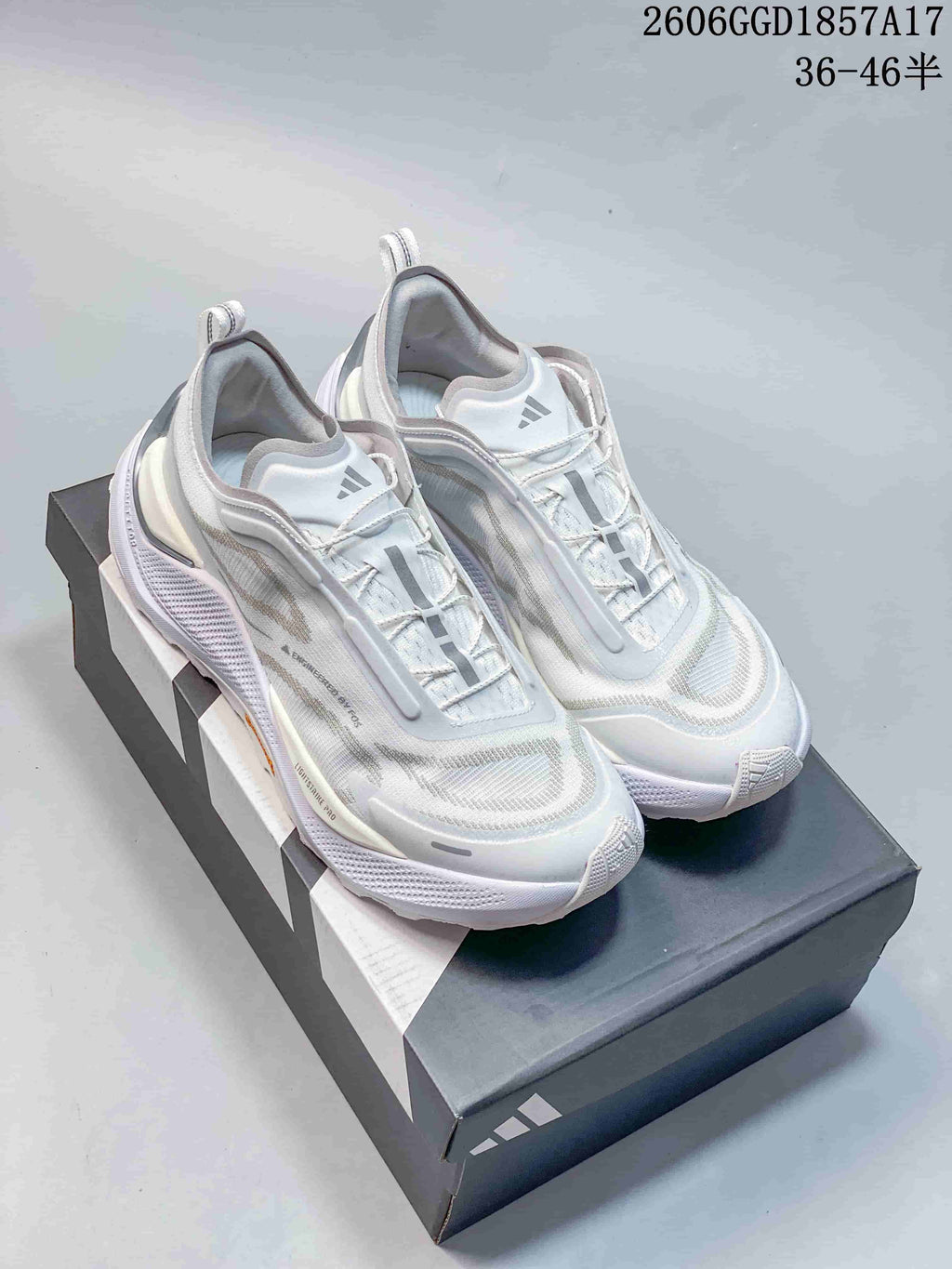 Pair of white Adidas HOLO PEAK shoes displayed on a shoe box