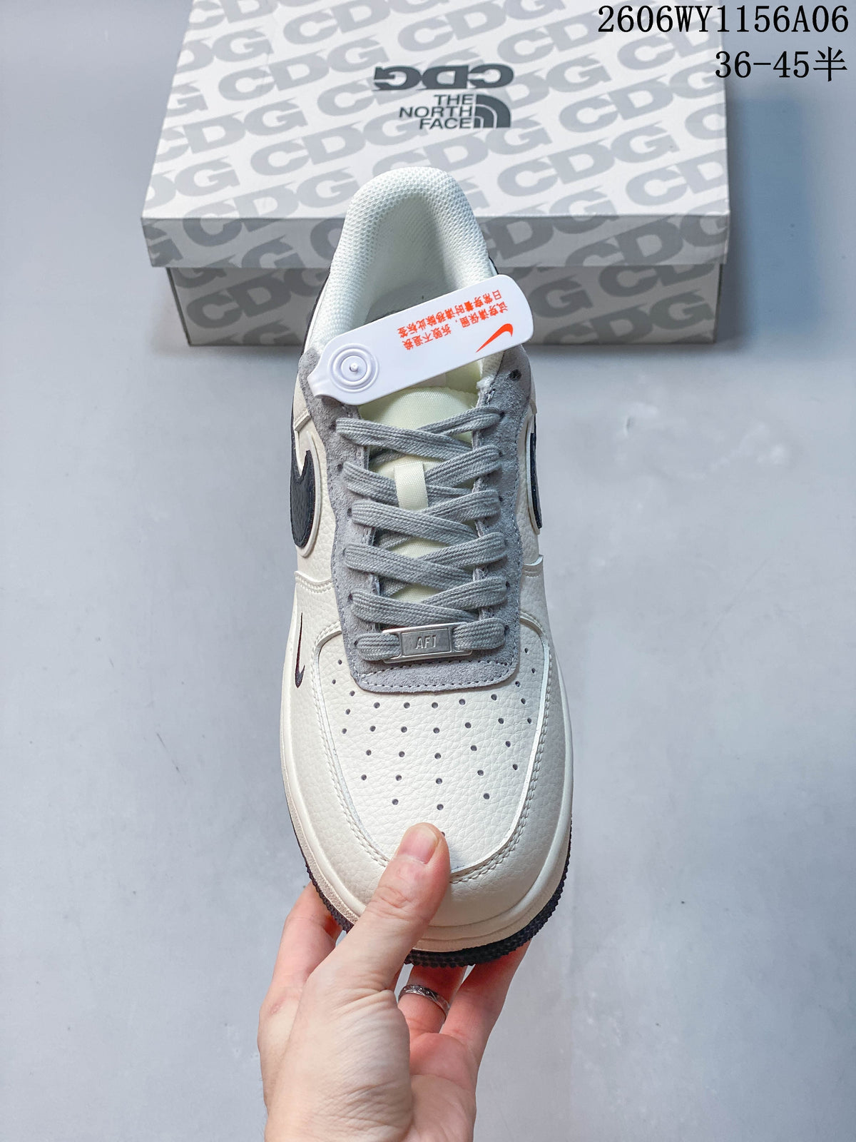 Top view of a Nike Air Force 1 '07 Low sneaker with gray laces and a perforated toe.