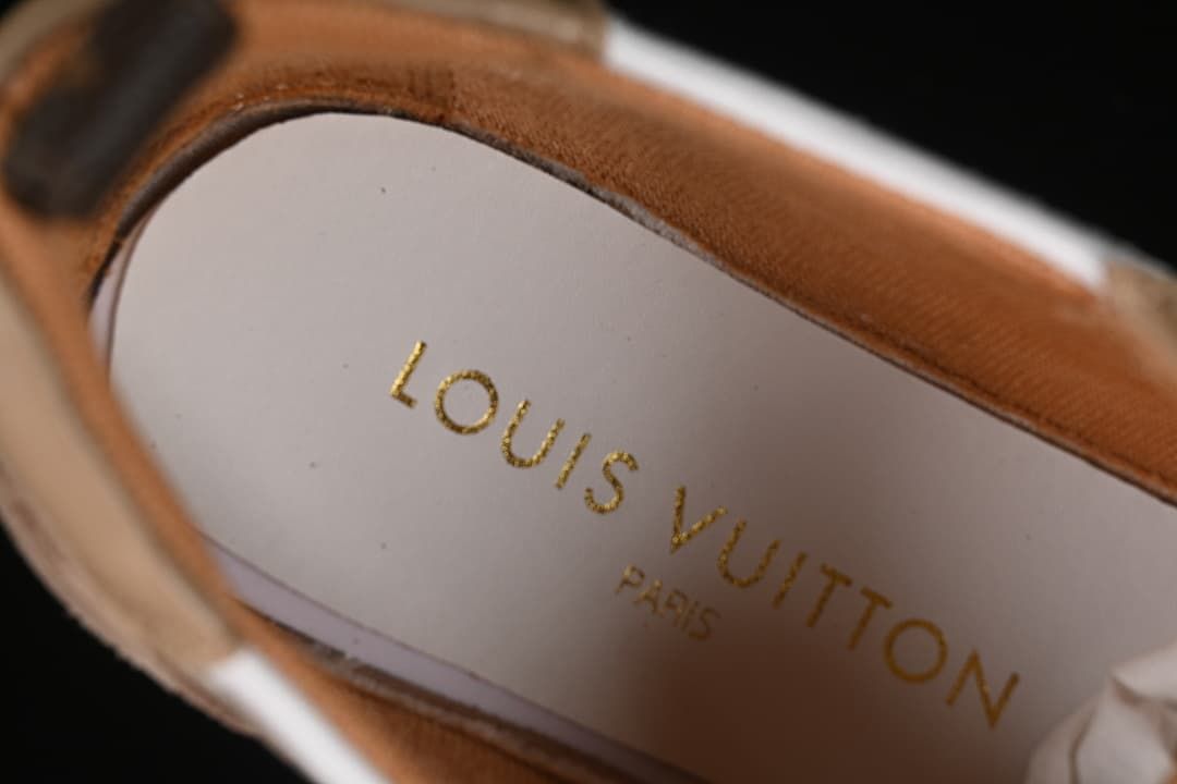Close-up of the branded insole and beige upper