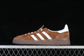 Side profile of brown and white adidas Handball Spezial sneakers with a gum-tone sole