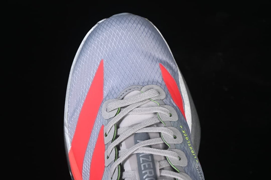 Top-down view of the shoe showing its toe shape and coral stripes