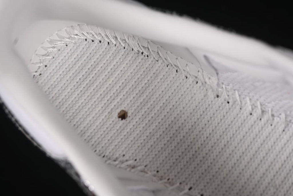 Close-up of the sneaker's white textured insole