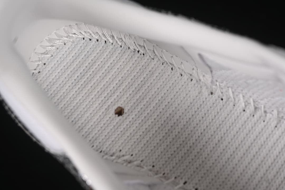 Close-up of the sneaker's white textured insole