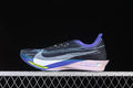 Side view of the Nike ZoomX Streakfly 2 in a dark patterned upper with blue, violet, pale pink and yellow-green accents.