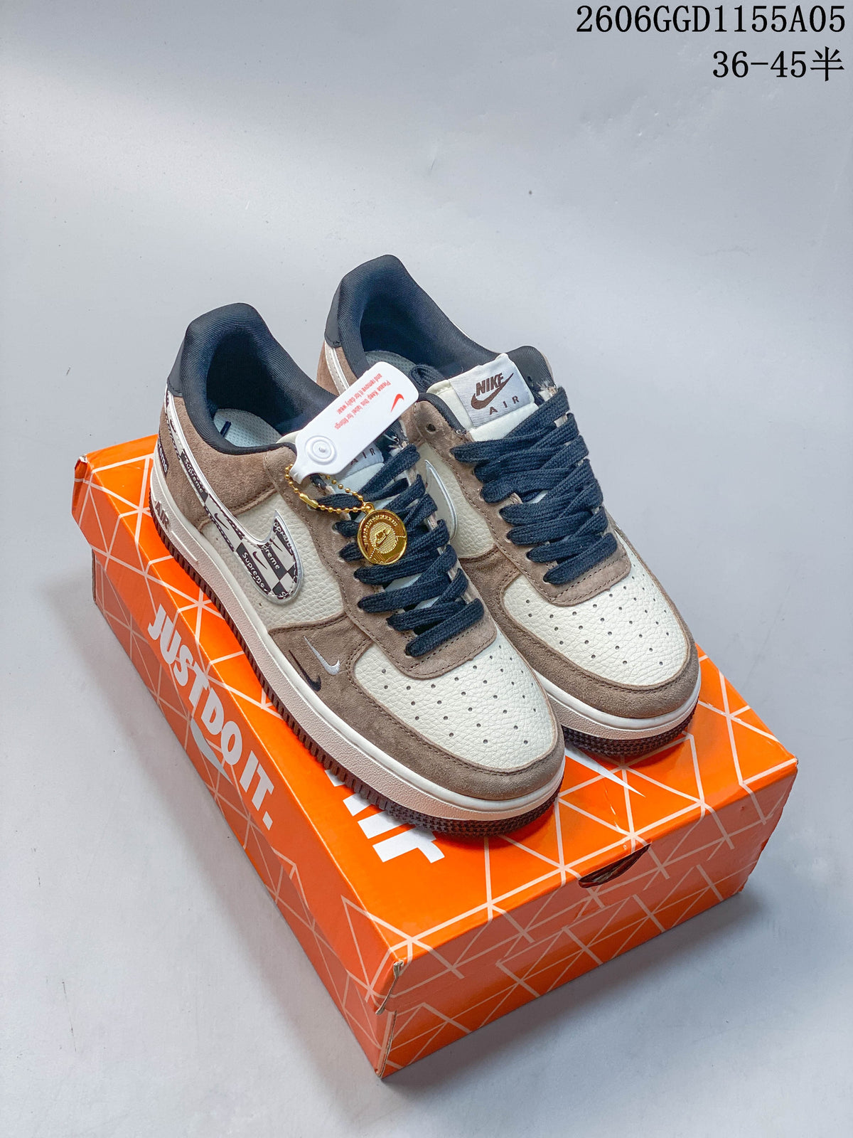 Pair of gray and white low-top sneakers shown on an orange shoebox