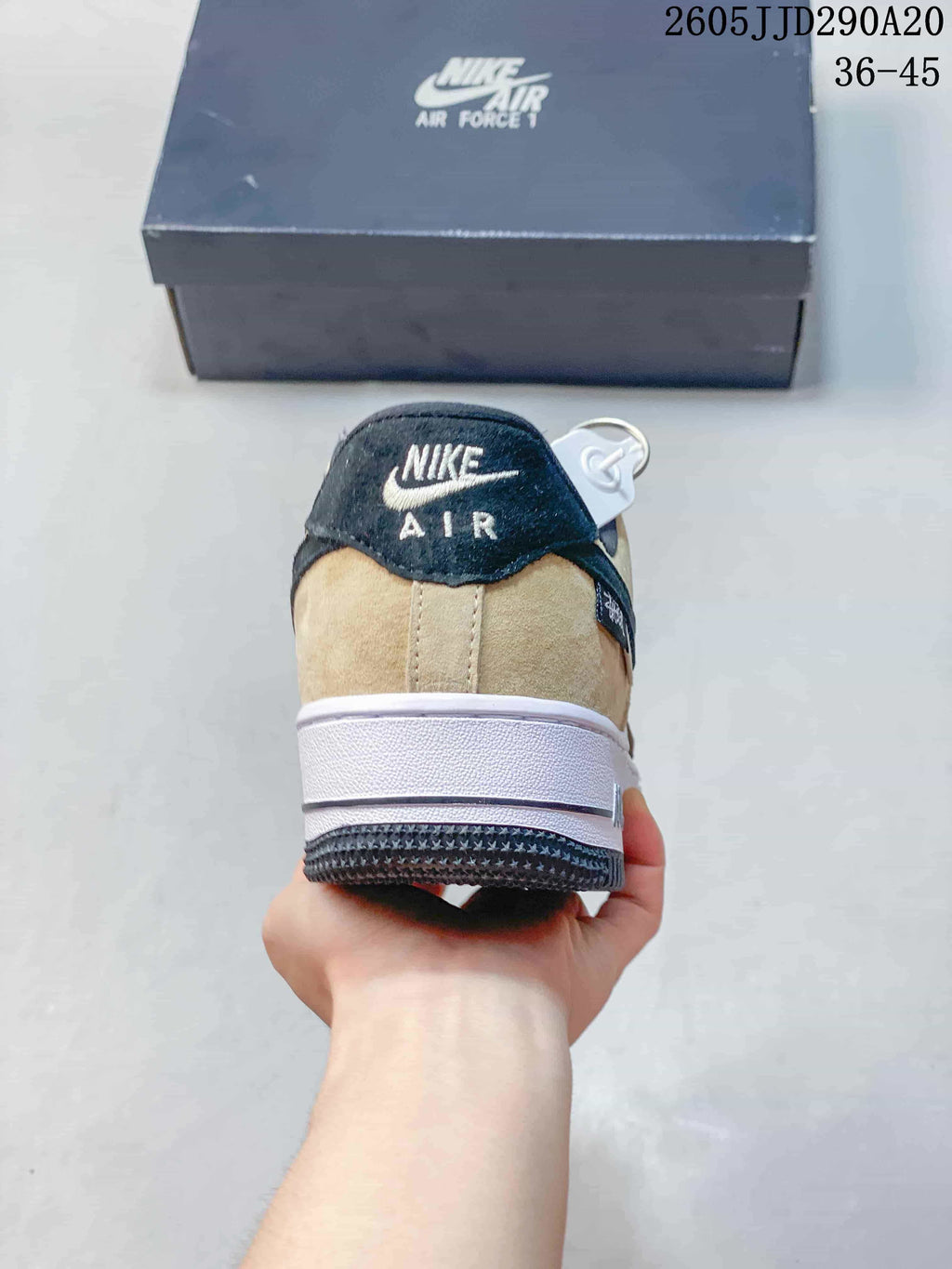 Rear view of the sneaker with a layered heel and contrasting outsole