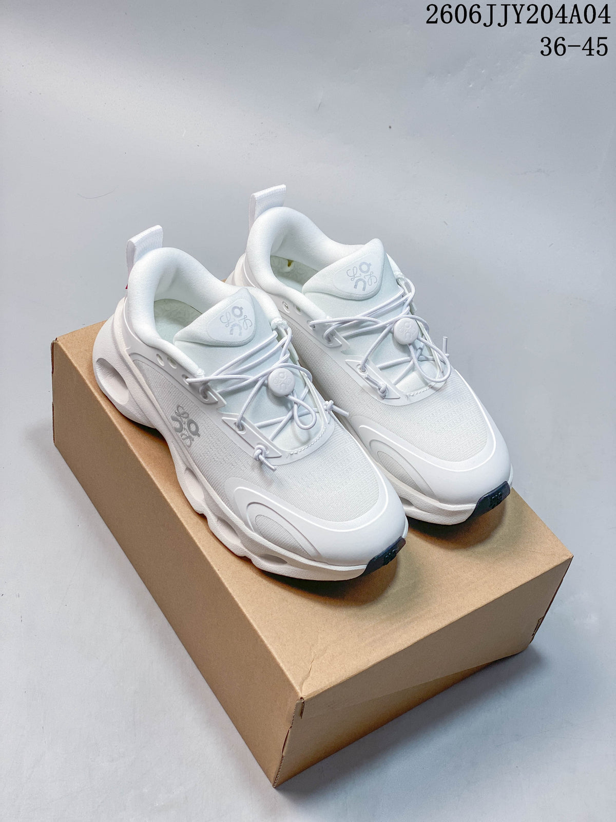 Pair of white On Cloudtilt sneakers with toggle-style lacing on a box