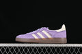 Side view of purple adidas Handball Spezial sneakers with cream stripes and brown sole