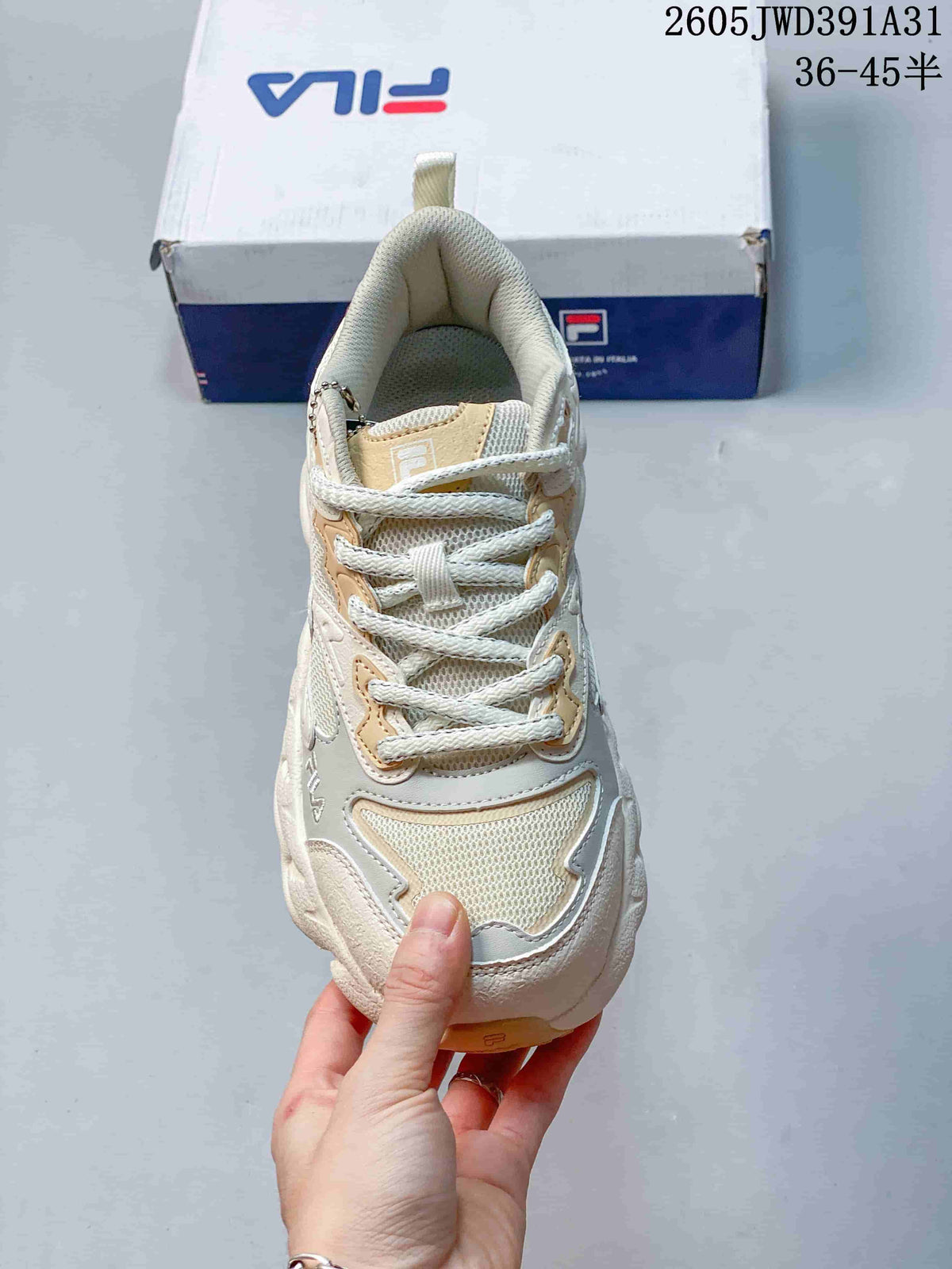 Front view of the lace-up FILA sneaker with mesh and layered overlays