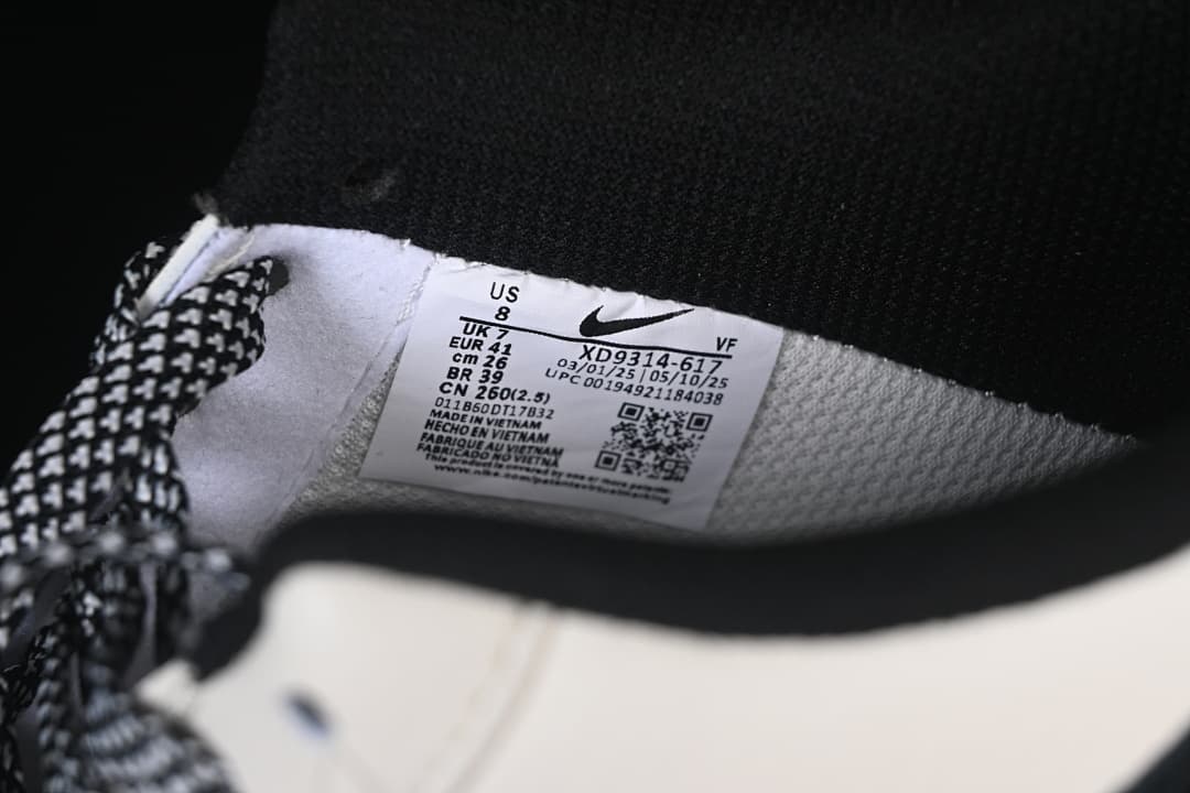 Close-up of the shoe label showing US 8, UK 7, EU 41, and style code XD9314-617.