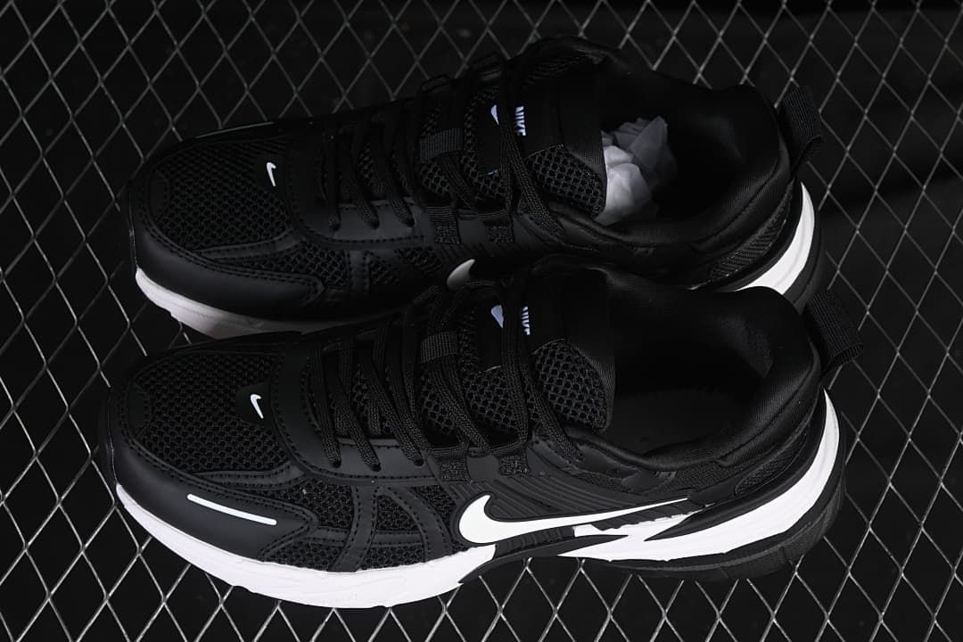 Pair of black and white Nike V2K Run shoes shown from above.