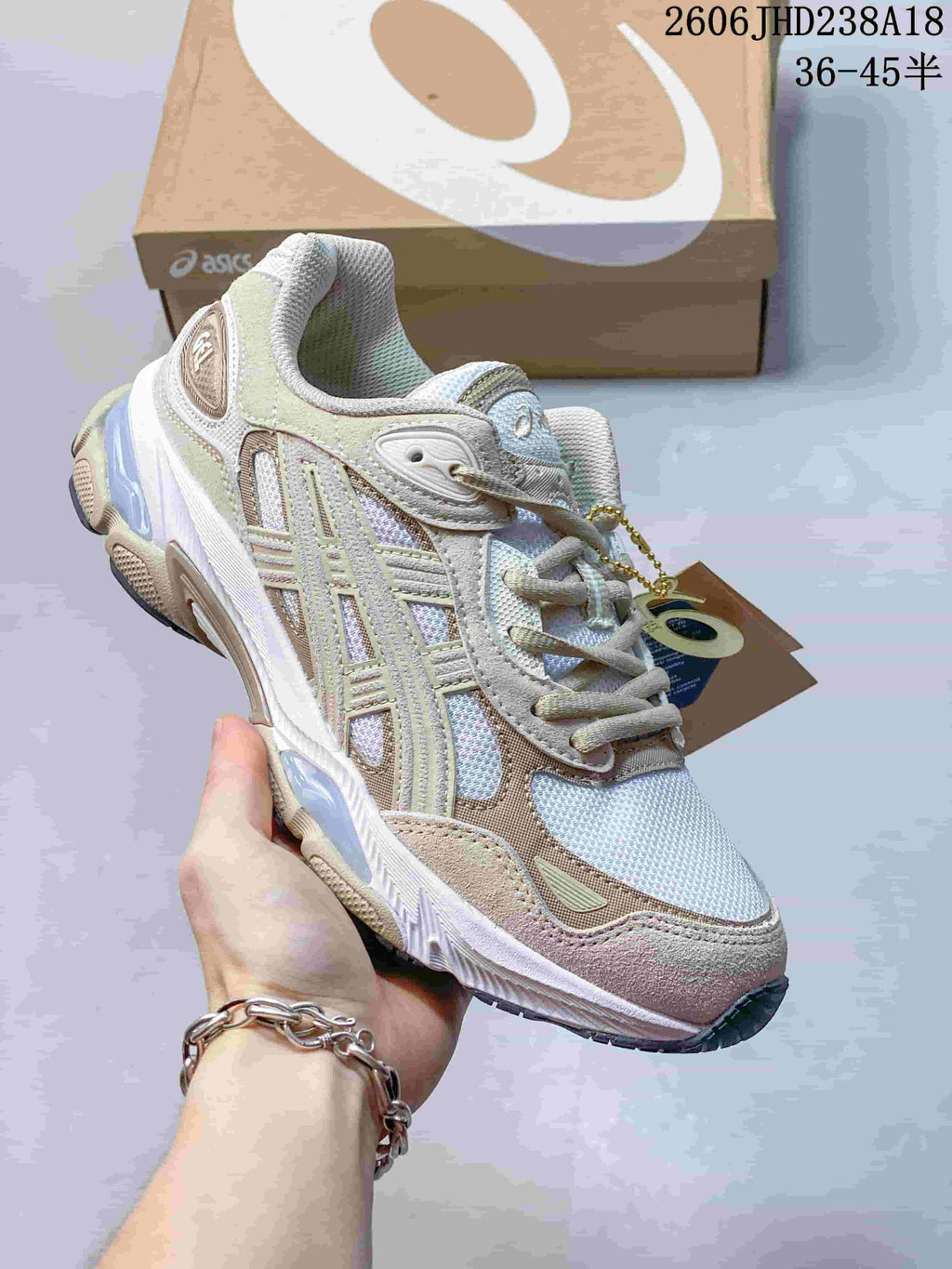 Side view of a light-colored sneaker with beige overlays and pastel accents