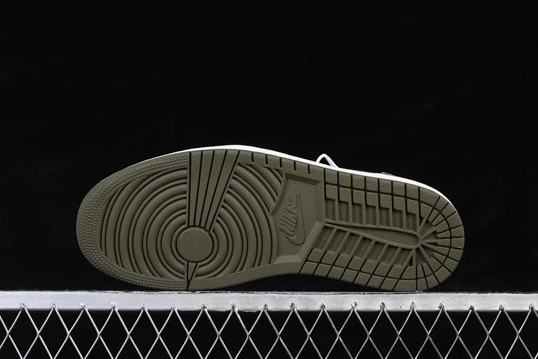Underside view showing the olive-colored tread