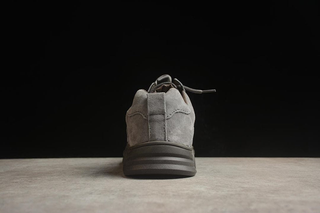 Rear view showing the heel pull tab and layered dark outsole.
