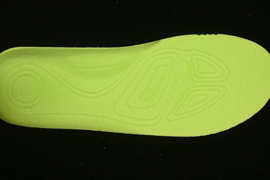 Bright yellow-green shoe insert shown from above